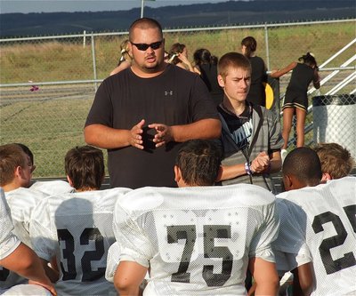 Image: Coach Brandon Duncan inspires his troops during halftime.