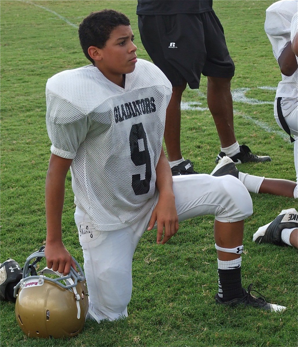 Image: Tylan Wallace(9) relaxes during halftime.