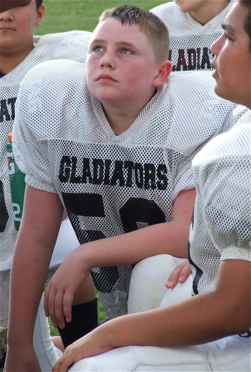 Image: Hunter Morgan(58) takes in the coaches advice.