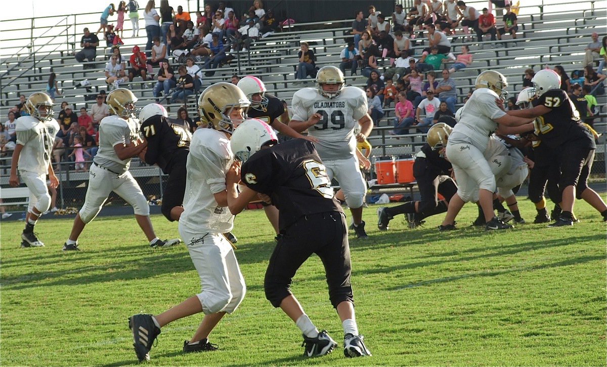 Image: Ty Hamilton(17) blocks downfield for his 7th grade teammates.