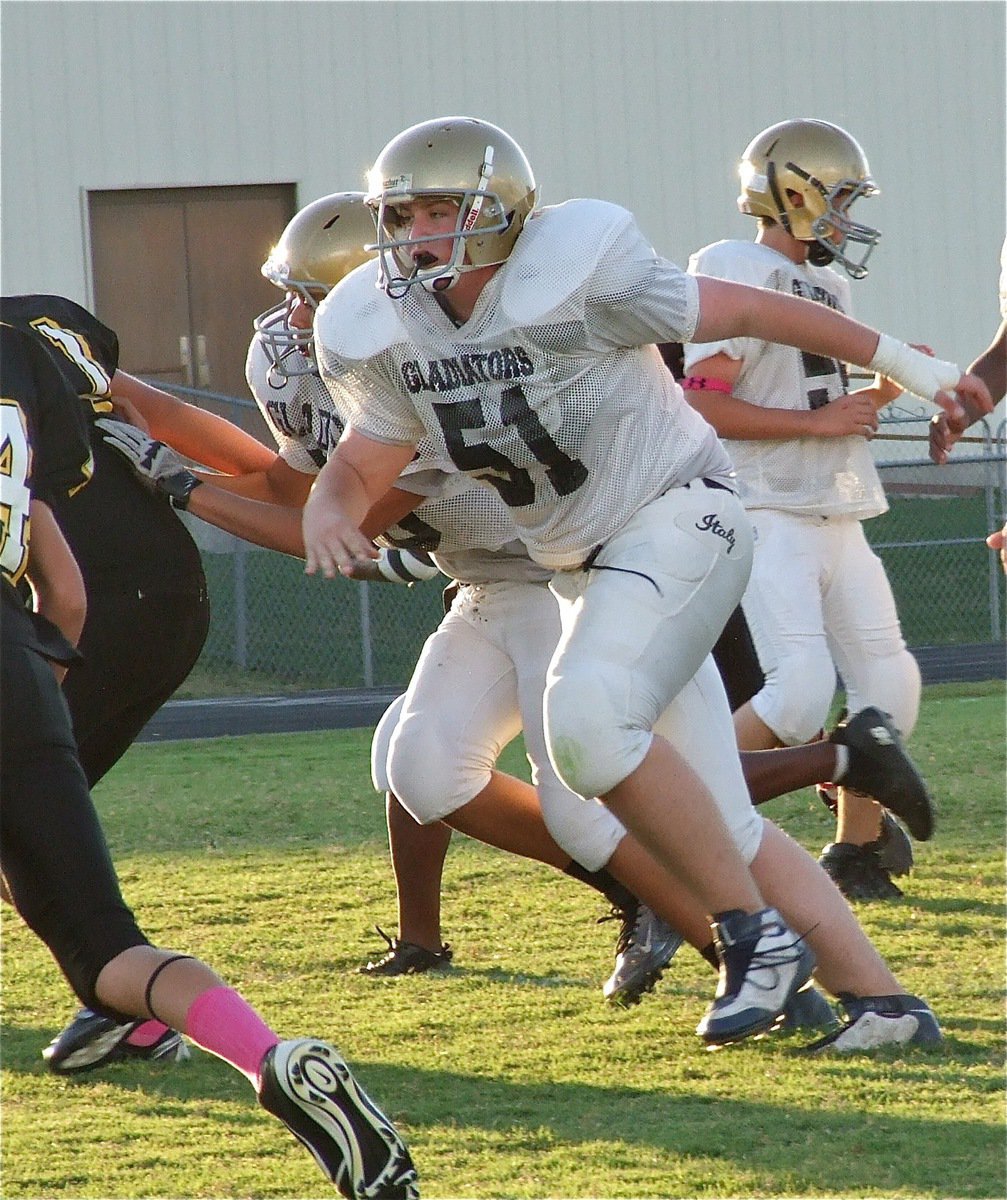 Image: Austin Pittman(51) goes after a Wampus Cat linebacker.