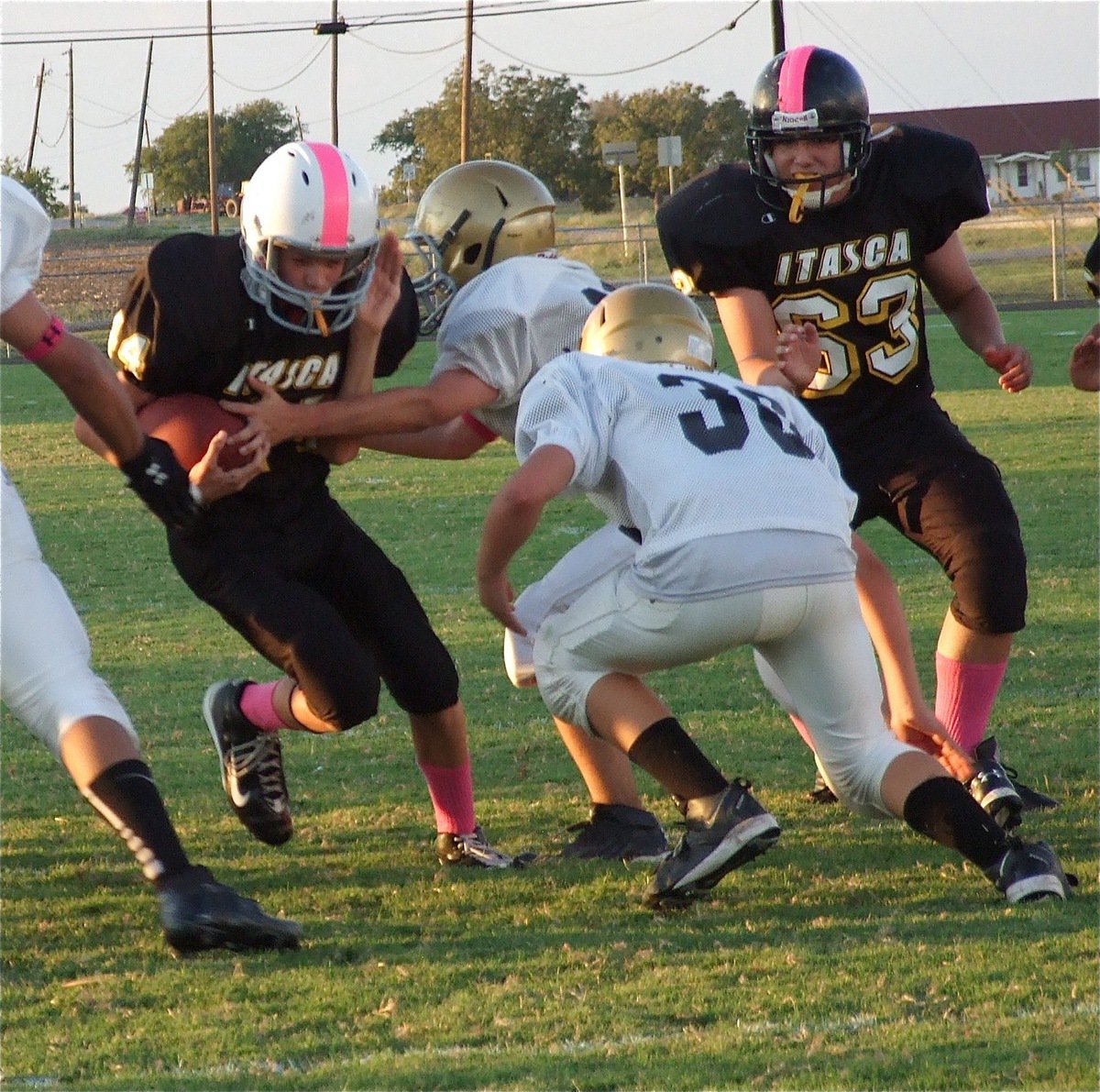 Image: Blake Brewer(30) helps his teammates keep the Cats out of the end zone.