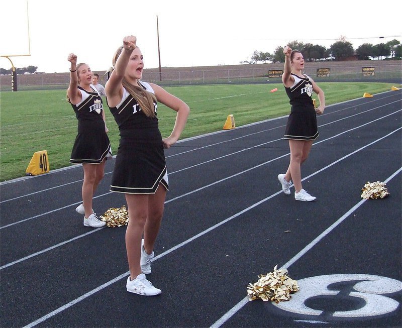 Image: Meagan Connor, Annie Perry and Brooke DeBorde cheer for the 8th grade Gladiators.