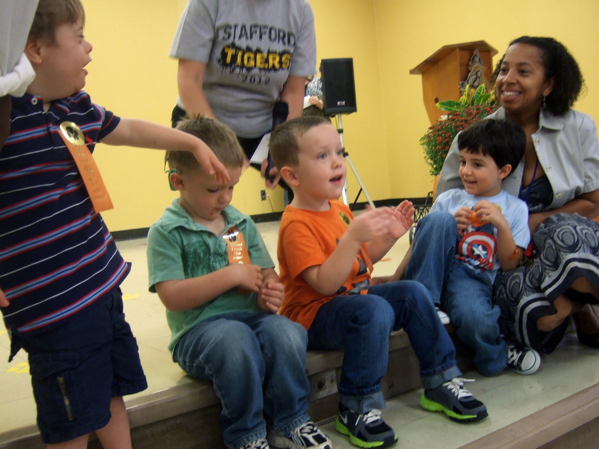 Image: Mrs. Dorazil’s pre-K PPCD class are enthusiastically accepting their awards for perfect attendance.