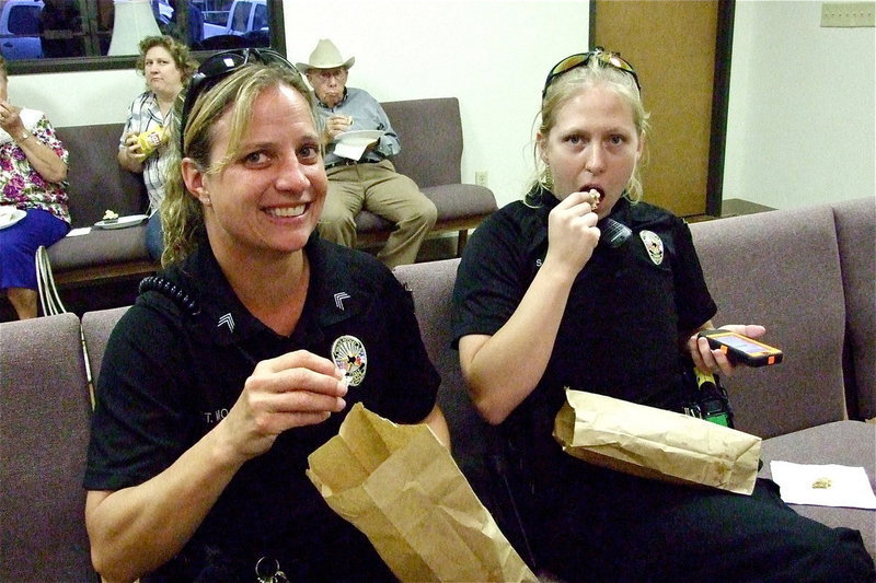 Image: Sergeant Tierra Mooney and Officer Shelbee Landon are REALLY enjoying the popcorn during the Italy Opry.