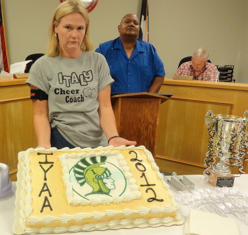 Image: Cake was served at the reception 
    (L-R: Becky Boyd, Mayor Frank Jackson, Greg Richards)