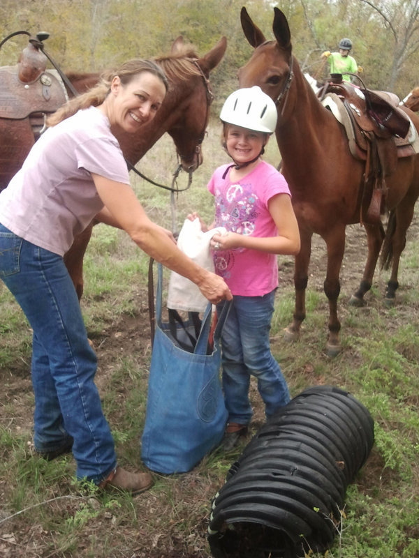 Image: Monica and Parys Bishop spent lots of time dismounting from their mules to pick up trash off the trails.