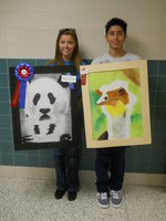 Image: Anna Riddle and Joseph Sage with their prize winning art pieces.