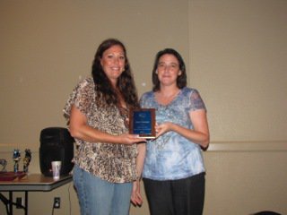 Image: ECEA Secretary Mary Roberts, right, presents Jody Clemmons of Waxahachie with the Billie Wesson Most Active New Member Award.