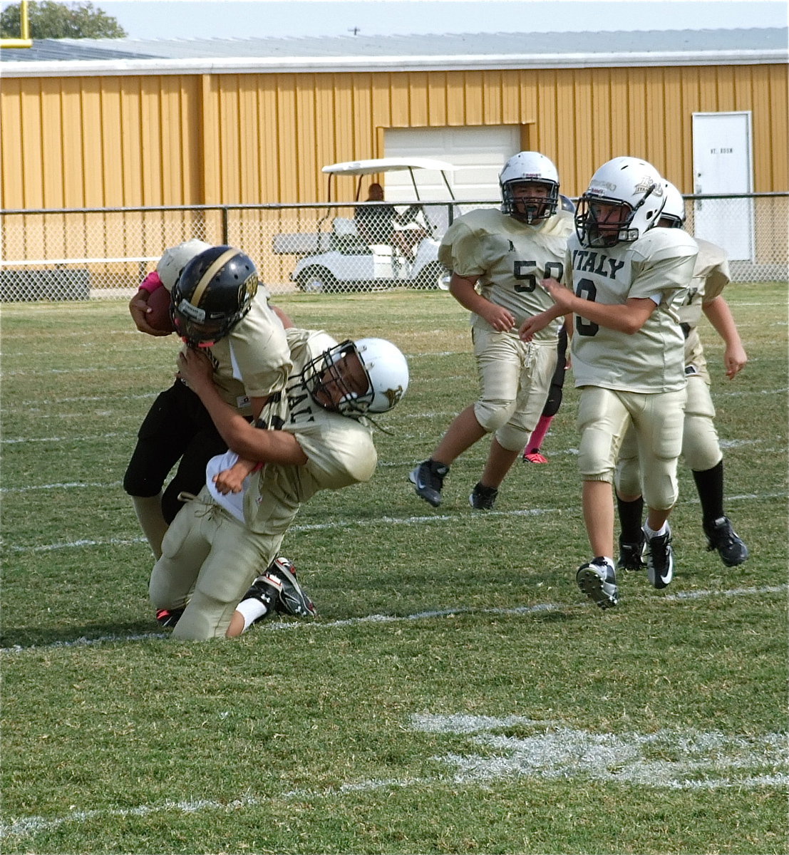 Image: Jonathan Salas(82) drags down a Jaguar to make the play for the A-Team Gladiators.