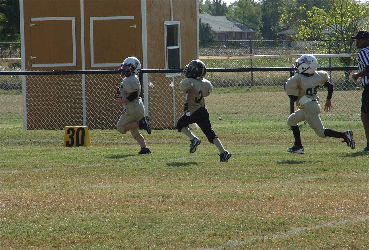 Image: Bryce DeBorde(4) puts his IYAA B-Team Gladiator squad up 6-0 after sprinting 72-yards for the games first touchdown.