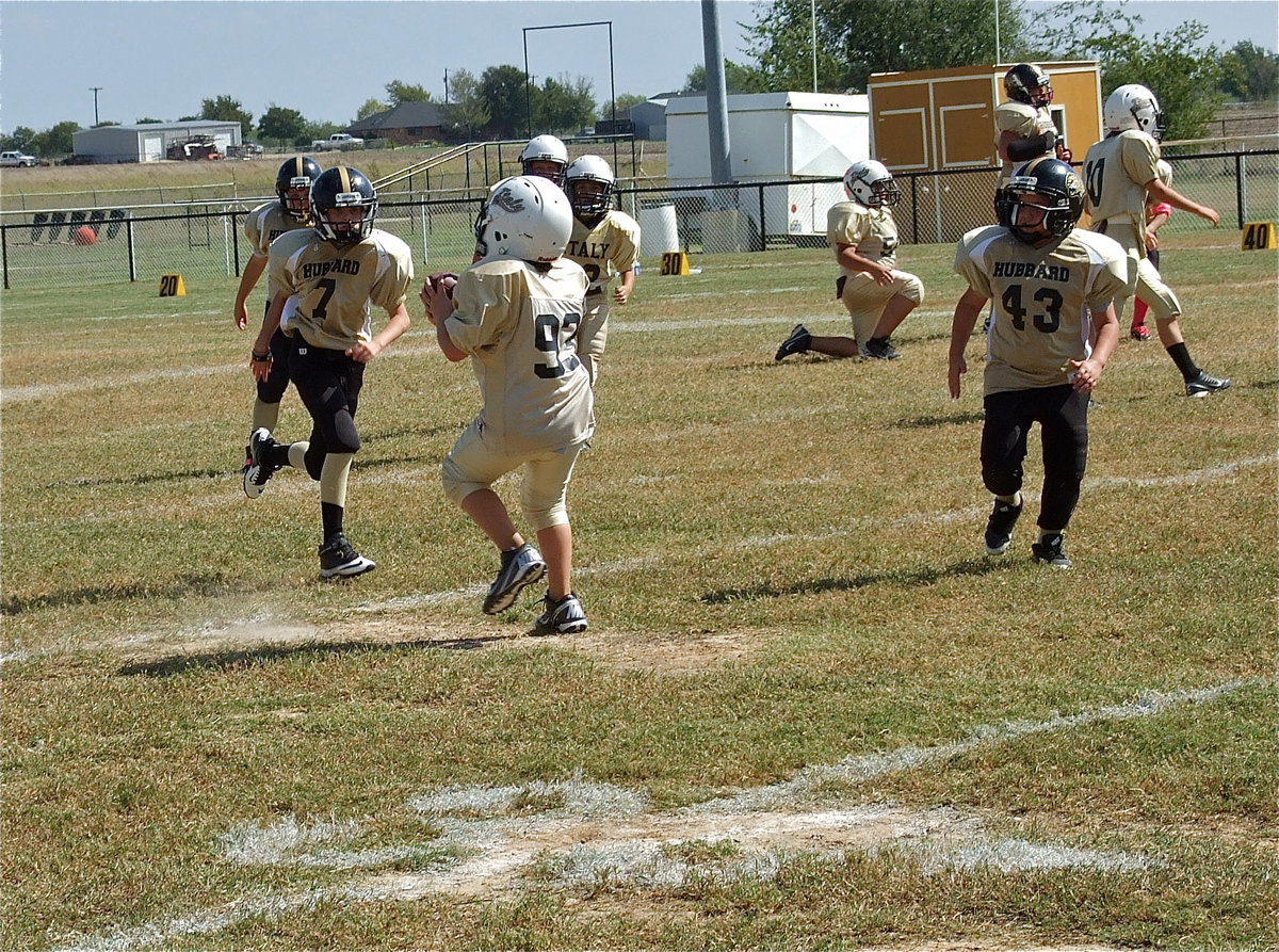 Image: Cason Roberts(93) pulls in a pass from quarterback Ethan Itson. Roberts turns and runs for the first down before being tackled.