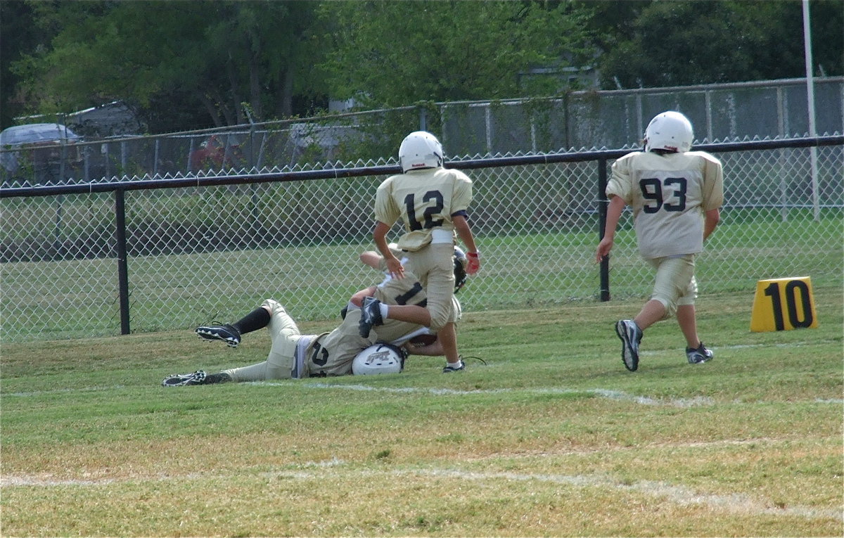 Image: Cade Brewer(21) keeps Hubbard from reaching the end zone to end the game against Hubbard as Michael Gonzalez(12) and Cade Roberts(93) hustle downfield for backup.