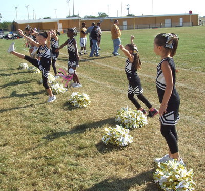 Image: The IYAA B-Team cheerleaders kick up some spirit along the sideline.