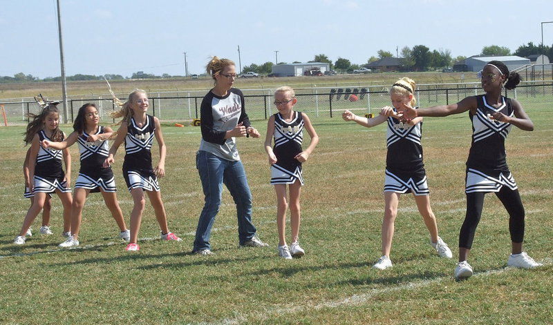 Image: Line Dance Fail: NEH league president, Janie Adair, busts a move with the IYAA A-Team Cheerleaders during halftime.