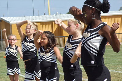 Image: The IYAA A-Team cheerleaders perform with gusto!