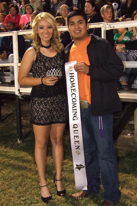 Image: 2011 Homecoming Queen and King, Megan Richards and Omar Estrada, prepare to crown the 2012 Italy High School Homecoming Queen during halftime.