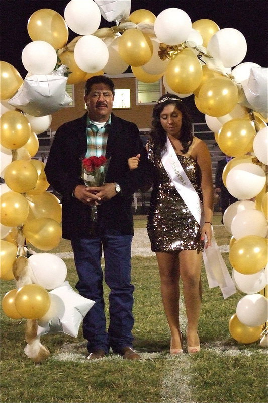 Image: 2012 IHS Homecoming Princess Julissa Hernandez is escorted by her father.