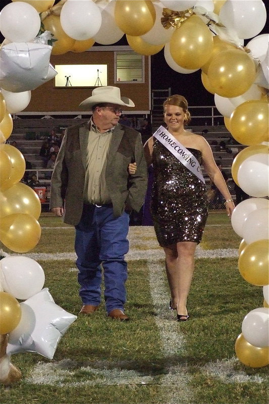Image: 2012 IHS Homecoming Queen nominee Katie Byers is escorted by her father Brentley Byers.