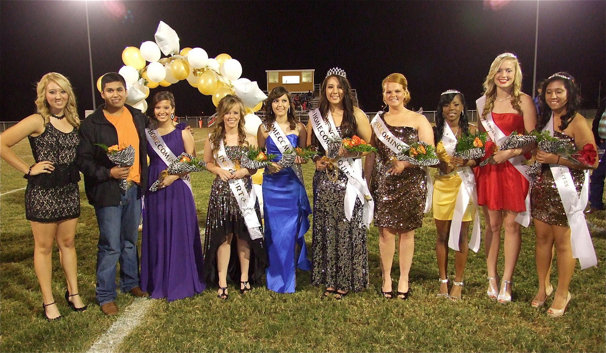 Image: 2012 Homecoming Queen Alyssa Richards stands with her court: her princesses: (L-R): The 2011 Homecoming Queen Megan Richards, the 2011 Homecoming King Omar Estrada, queen nominees Morgan Cockerham, Felicia Little, Paola Mata, Alyssa Richards and Katie Byers, and princesses Kendra Copeland, Madison Washington and Julissa Hernandez.