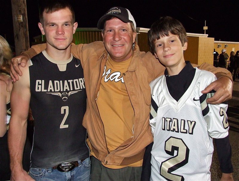 Image: Chase Hamilton(2), with his father Lee Hamilton and younger brother Ty Hamilton who wears his older brother’s jersey in his honor but sports #17 when playing for Italy’s 7th grade Gladiators.