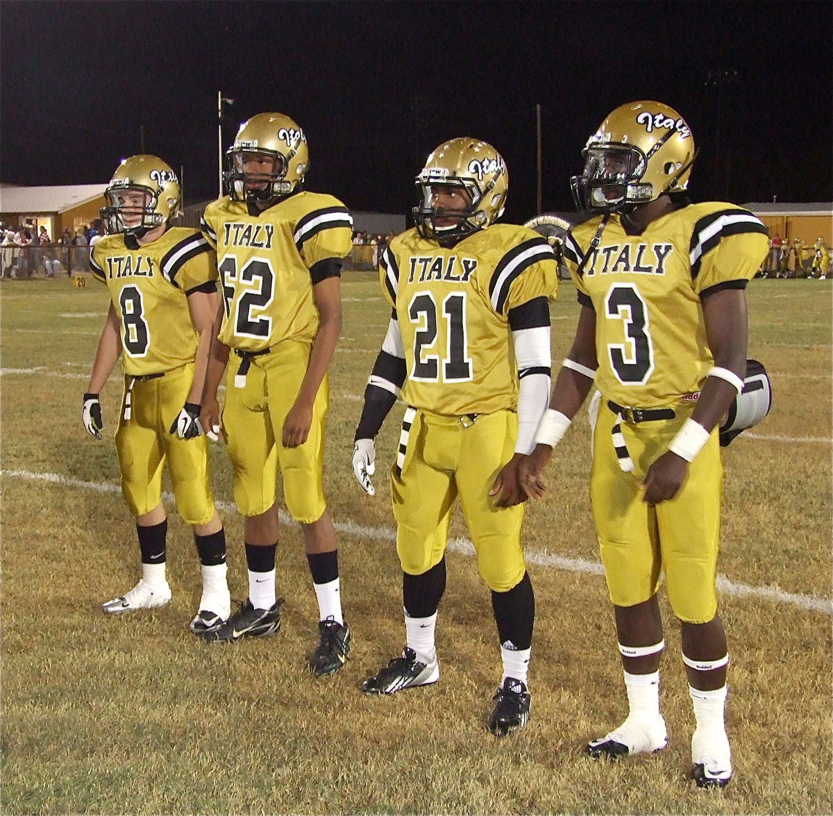 Image: Gladiator Captains are (L-R) Hayden Woods, John Hughes(62), Jalarnce Jamal Lewis(21) and Marvin Cox(3). Italy received the opening kickoff and scored 7-points on their first possession.