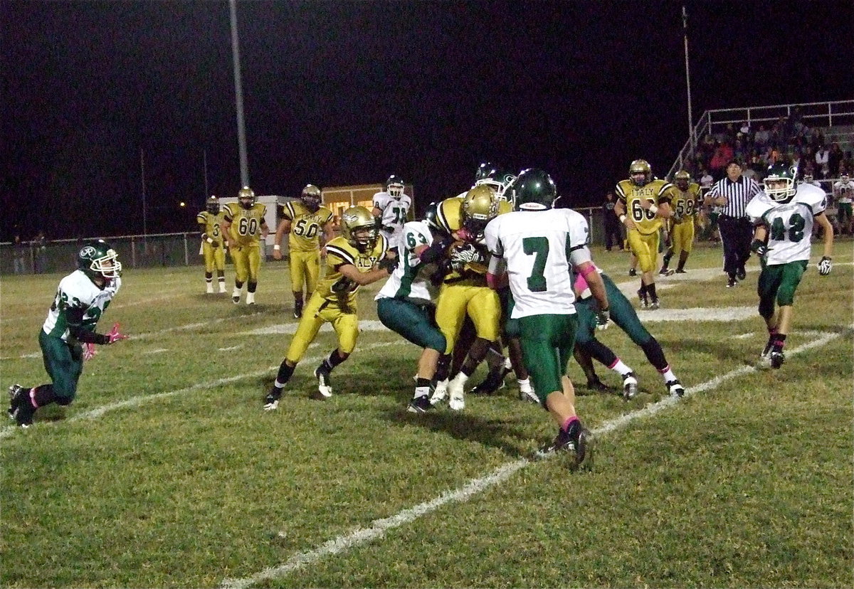 Image: Ryheem Walker(10) fights for extra yards with help from teammate Kelvin Joffre(80).