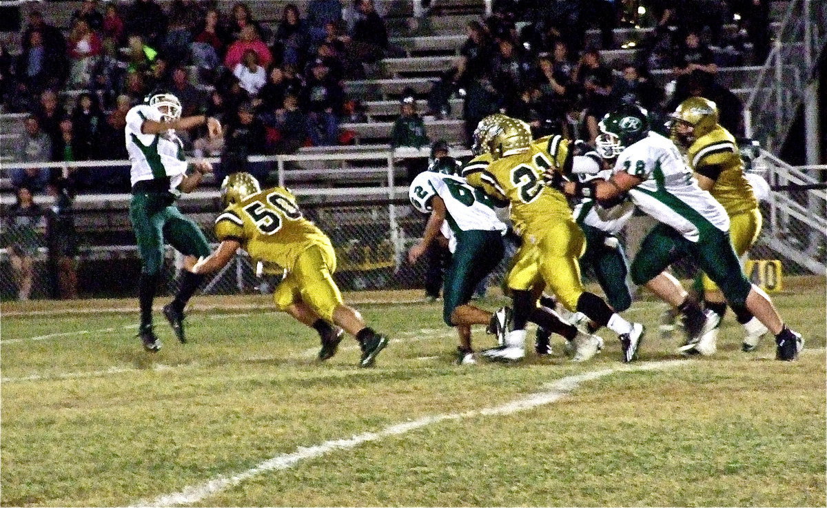 Image: Zain Byers(50) applies pressure forcing an incomplete pass attempt by the Bobcats during the first-quarter.