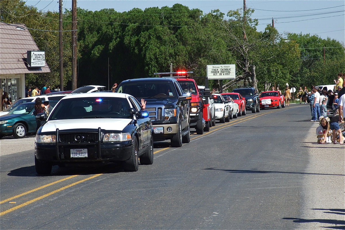 Image: Italy Police Chief Diron Hill leads the 2012 Italy High School Homecoming Parade thru downtown Italy.