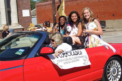 Image: The 2012 IHS Homecoming Princesses, Kendra Copeland, Julissa Hernandez and Madison Washington are escorted in style by Ann Hyles.