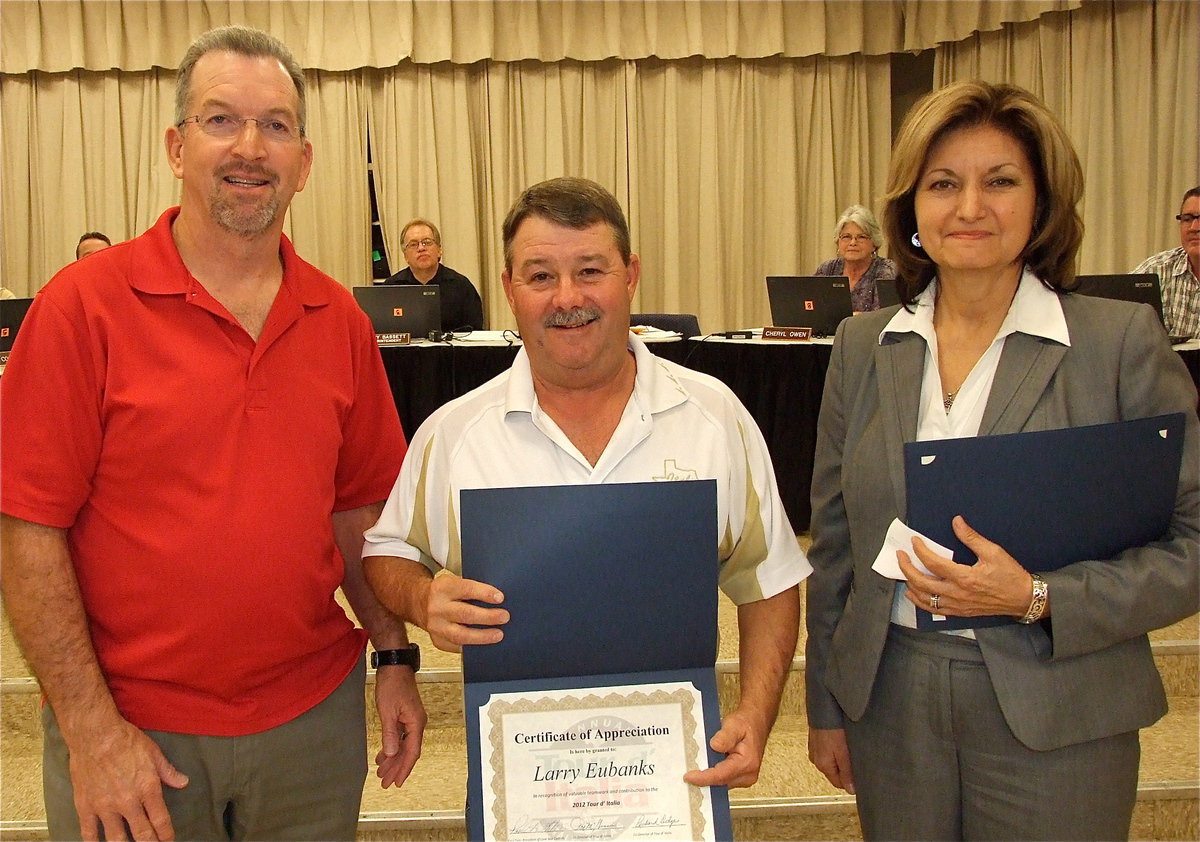 Image: Italy School Board President Larry Eubank is presented a Certificate of Appreciation by Paul Tate who represents Lone Star Cyclists from Grand Prairie and Pat McGennis, the Tour d ’Italia Director.