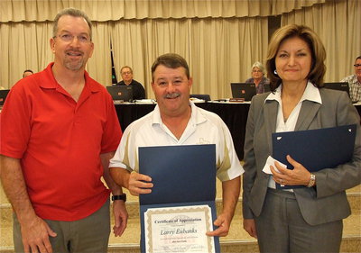 Image: Italy School Board President Larry Eubank is presented a Certificate of Appreciation by Paul Tate who represents Lone Star Cyclists from Grand Prairie and Pat McGennis, the Tour d ’Italia Director.