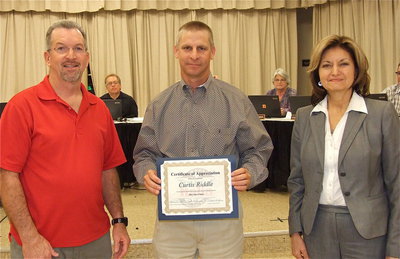 Image: Although he admits to being more of a horseman, Italy School Board member Curtis Riddle is also presented a Certificate of Appreciation by Paul Tate, who represents Lone Star Cyclists from Grand Prairie, and, Pat McGennis, the Tour d ’Italia Director.