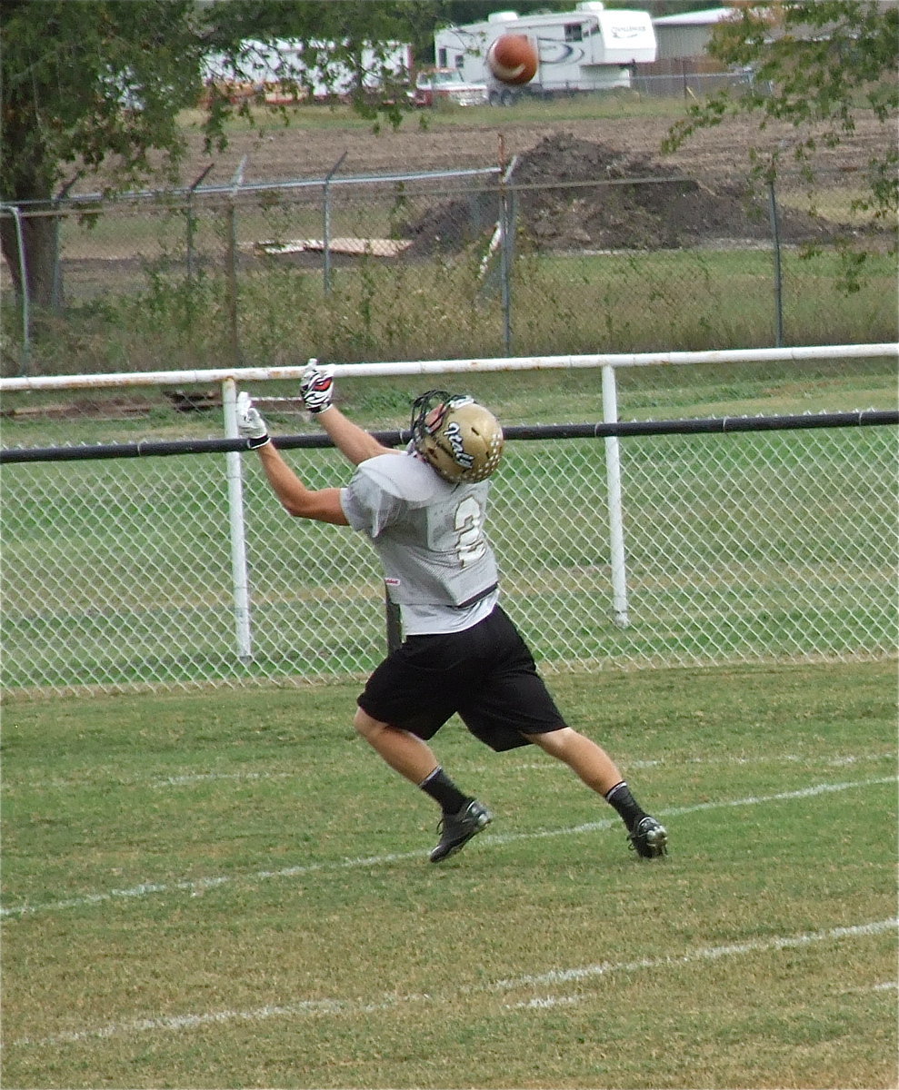 Image: Chase Hamilton(2) attempts an over-the-shoulder catch.