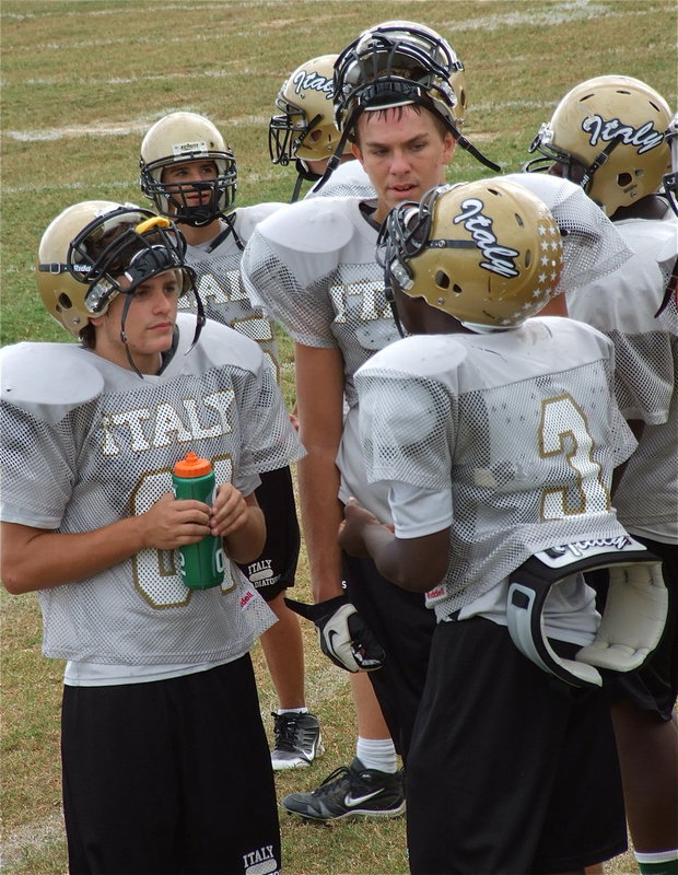 Image: Shop talk around the water cooler.