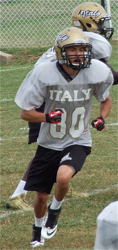 Image: Kelvin Joffre(80) turns upfield to block.