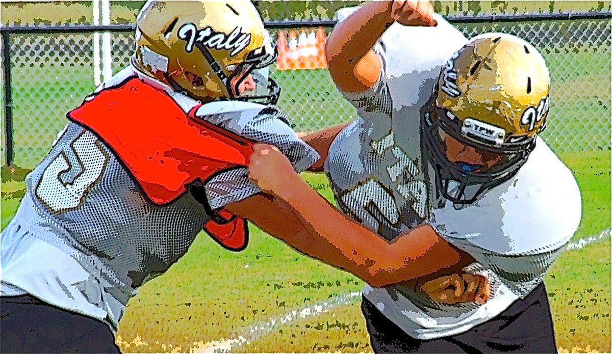 Image: Zackery Boykin(55) blocks Zain Byers(50) while Byers swims over the top.