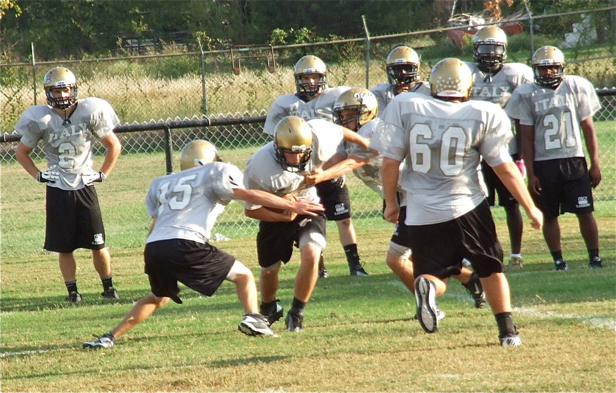 Image: Ryan Connor(15), Cody Medrano(75) and Kevin Roldan(60) converge on the ball.