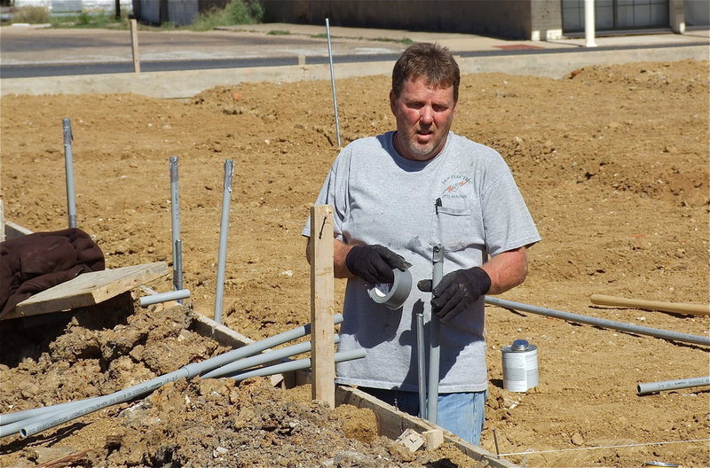 Image: Jimmy Weaver, owner of J&amp;S Electric, begins laying the ground work for the pavilion.