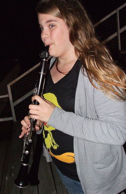 Image: Gladiator band member Christy Murray gets the party started with her clarinet.