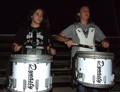 Image: Gladiator band members Alexis Sampley and Whitney Wolaver get the beat of champions going during the lighting ceremony.