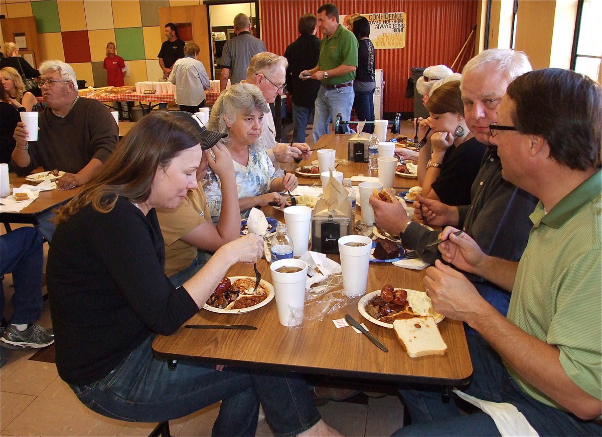 Image: Diana Herrin, daughter of Wanda and George Scott, and her husband John, dine with the Crowell family, including Thomas, Suzzy and Steve.