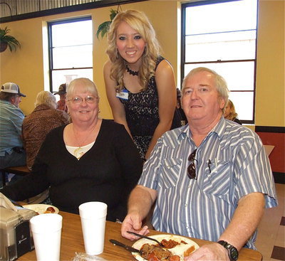 Image: Scholarship recipient Megan Richards poses with her grandparents, Elaine and Greg Richards.