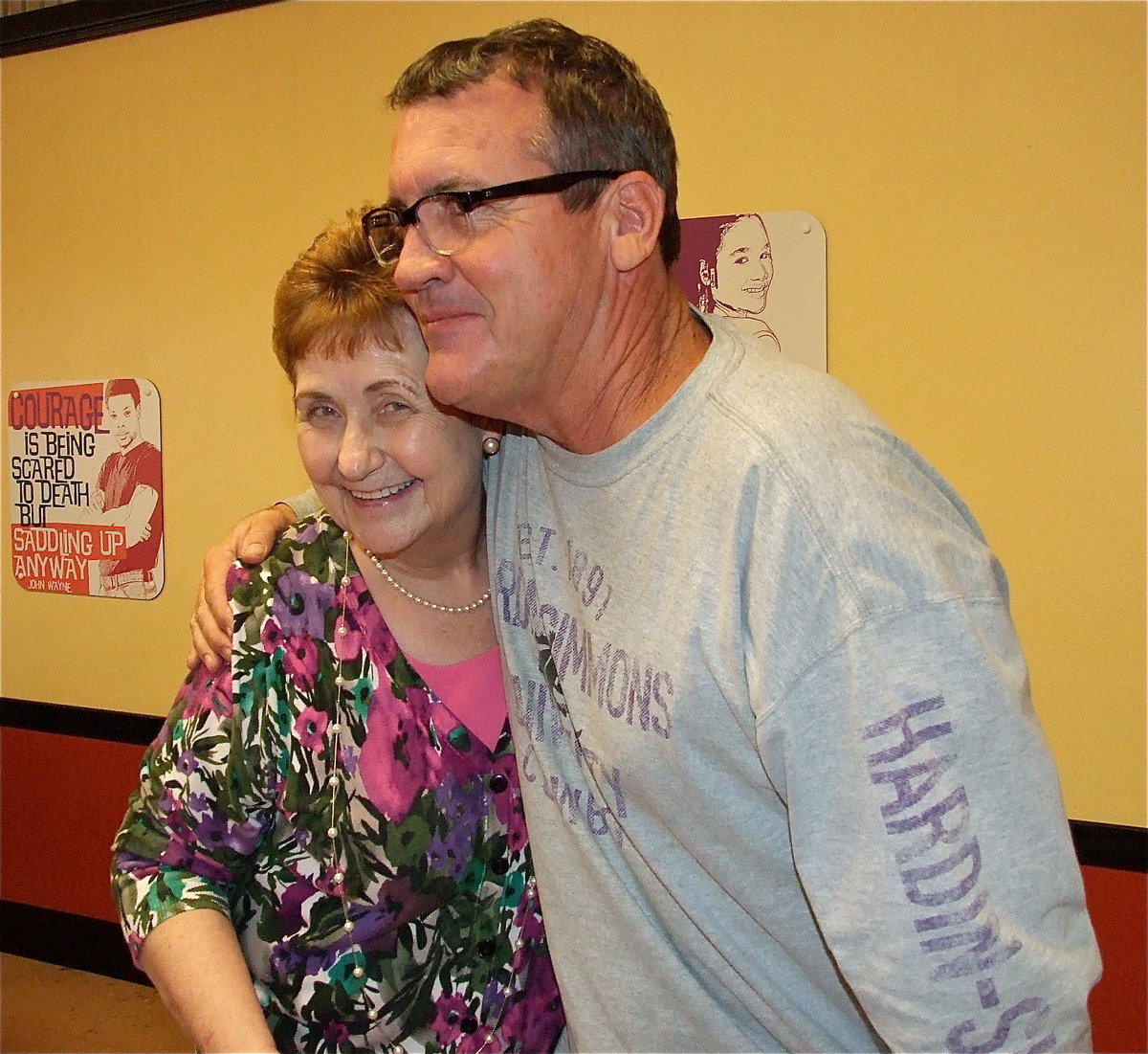 Image: Italy School Board member Russ Lewis gives Wanda Scott a hug for all her and her family continue to do for the students.