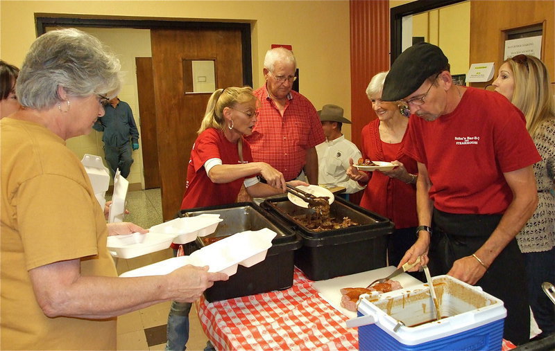 Image: “Skinny cook” from Bubba’s on the right, Cheryl Owen, George E. Scott Scholarship chairman, on the left….but real talk here—Our family loves, loves, loves to go to Bubba’s and eat a steak every once in a while. We travel all over Texas playing softball and dining out and cannot find a steak anywhere that we like any better than ones at Bubba’s in Ennis, Texas. We are extra happy when the “skinny cook” is on hand to cook our steaks. They say you should never trust a skinny cook but this does not hold true with this guy. He is a beast at making steaks taste magnificent!!! Oh lordy, my mouth is watering!!! (Kelly Lewis)