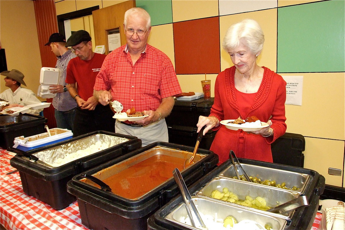 Image: Weldon and Frances Holley are ready to do their part for the students by eating a delicious meal.