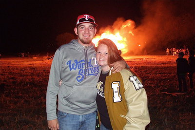 Image: Seniors Zackery Boykin and Katie Byers stay warm on a chilly night with a bonfire.