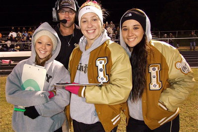 Image: Offensive coordinator Nate Skelton photo bombs his Lady Gladiators stat squad of Bailey Eubank, Jaclynn Lewis and Alyssa Richards.