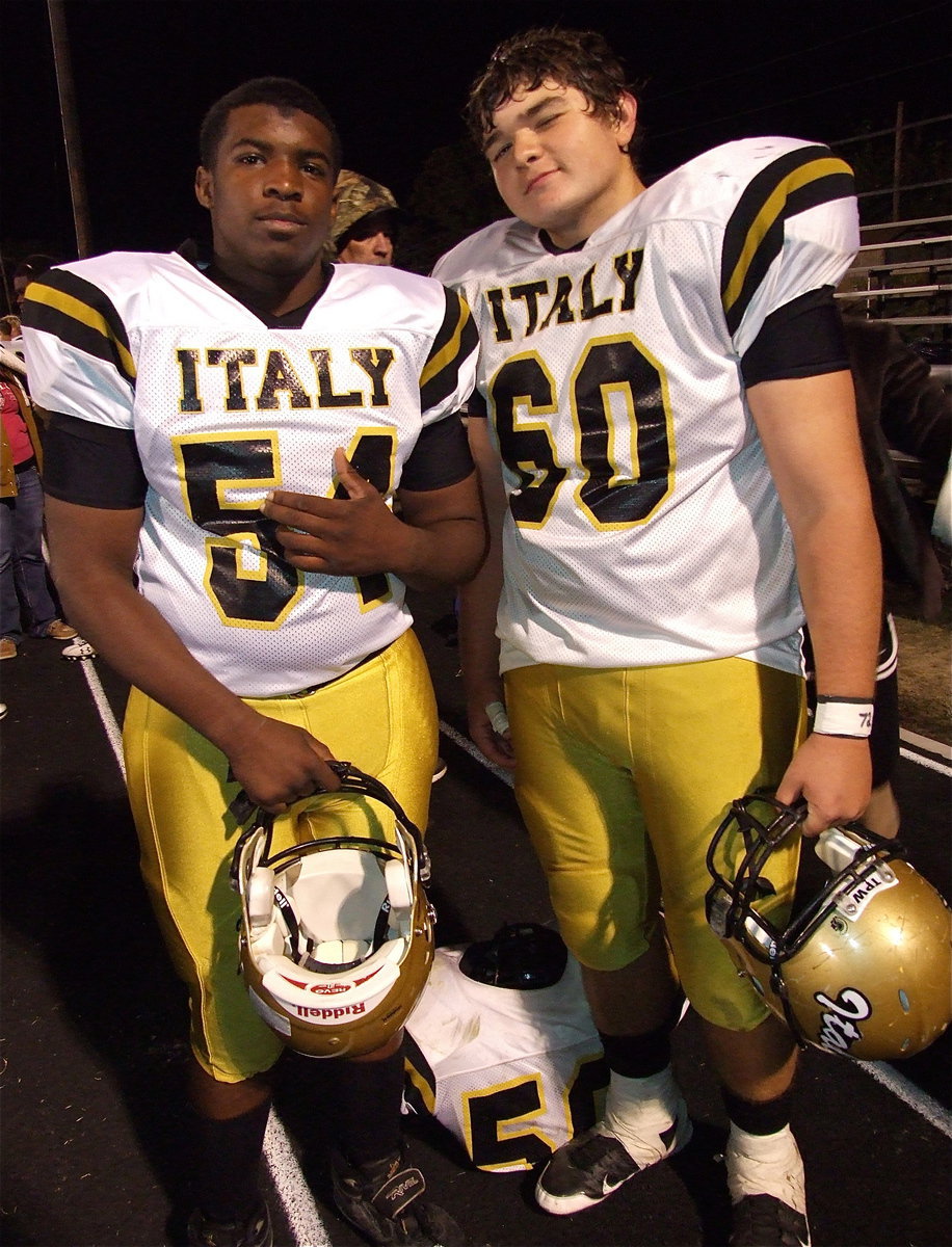 Image: Gladiators Justin Robbins(54) and Kevin Roldan(60) are proud of their team’s winning accomplishment, 20-16 over Cayuga!