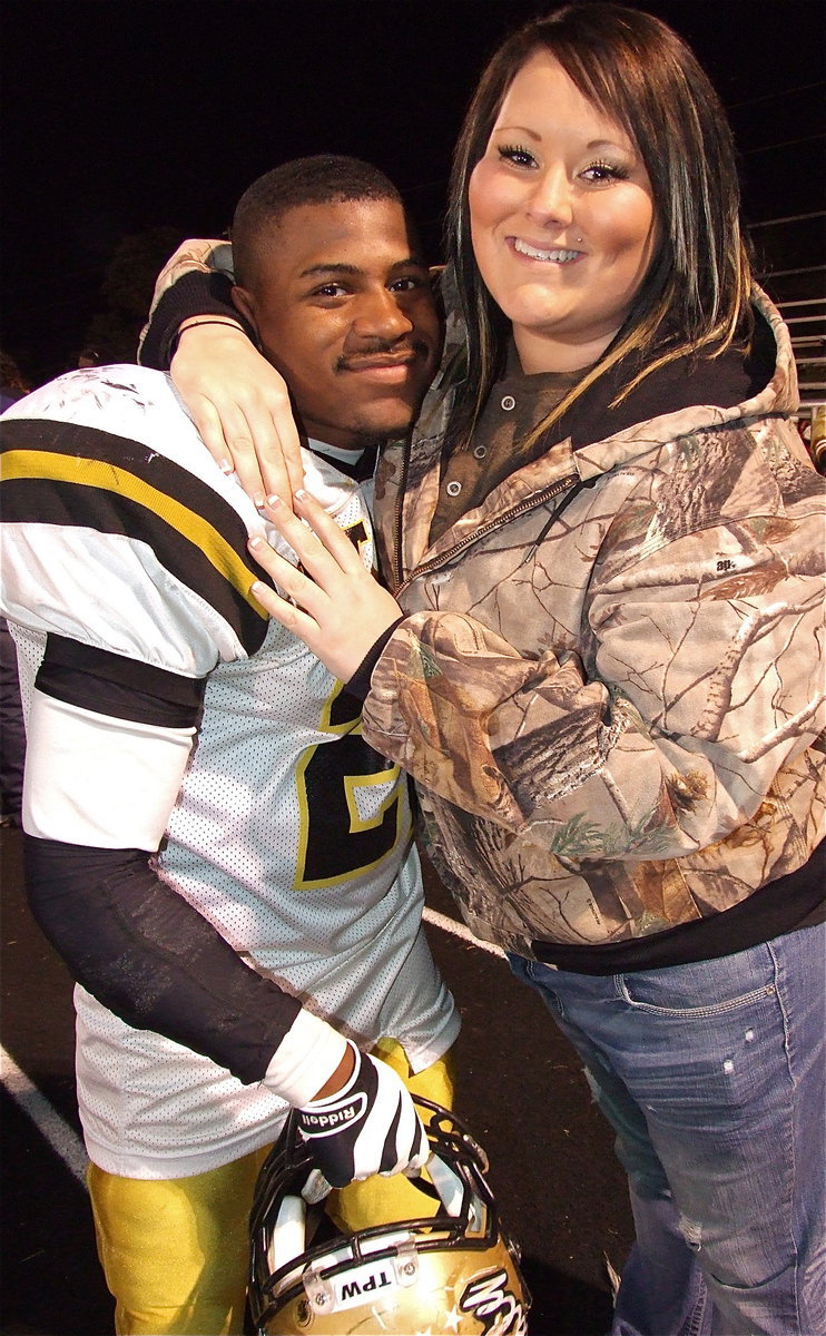 Image: Gladiator Jalarnce Lewis(21) is congratulated by Chelsea Beets.